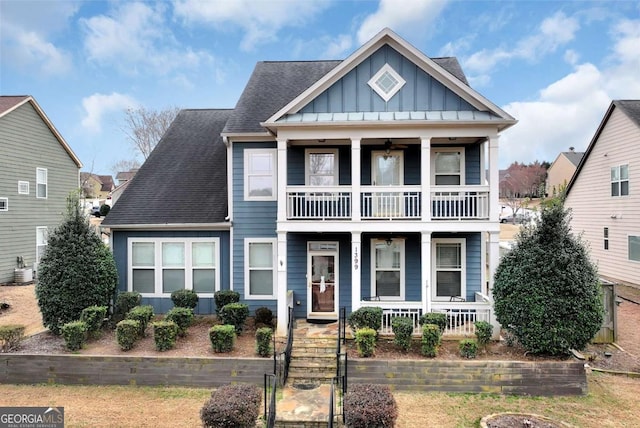 view of front of home with a balcony, covered porch, and central air condition unit