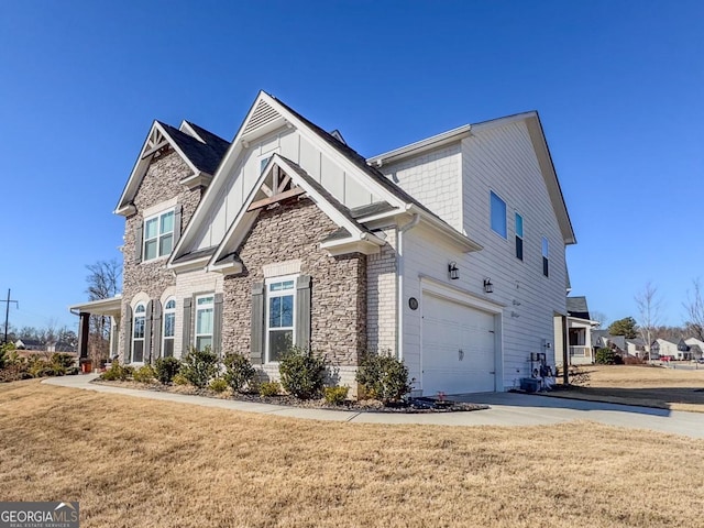 view of property exterior with a yard and a garage