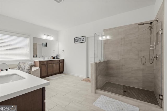 bathroom with vanity and an enclosed shower