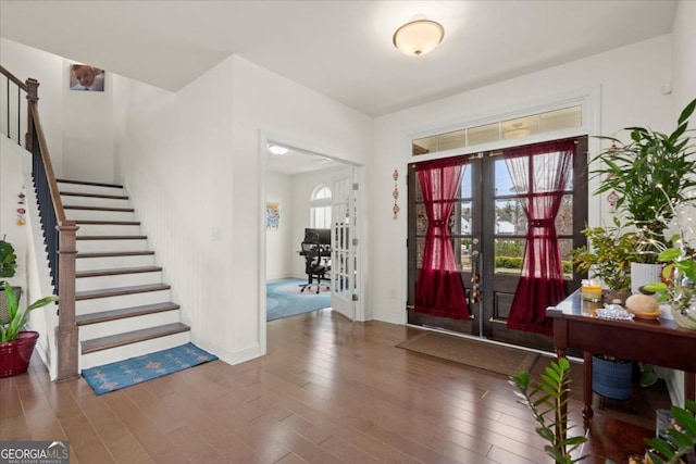 entryway with french doors and hardwood / wood-style floors