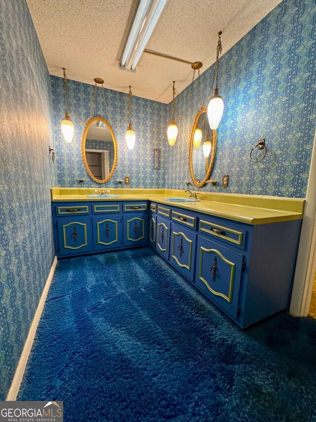 123 Blount St, Reidsville, GA 30453 - full bathroom with wallpapered walls, a textured ceiling, and a sink