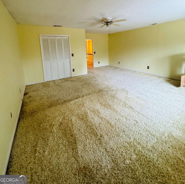 123 Blount St, Reidsville, GA 30453 - unfurnished bedroom with a textured ceiling, baseboards, visible vents, carpet, and a closet