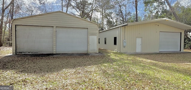 garage with a yard