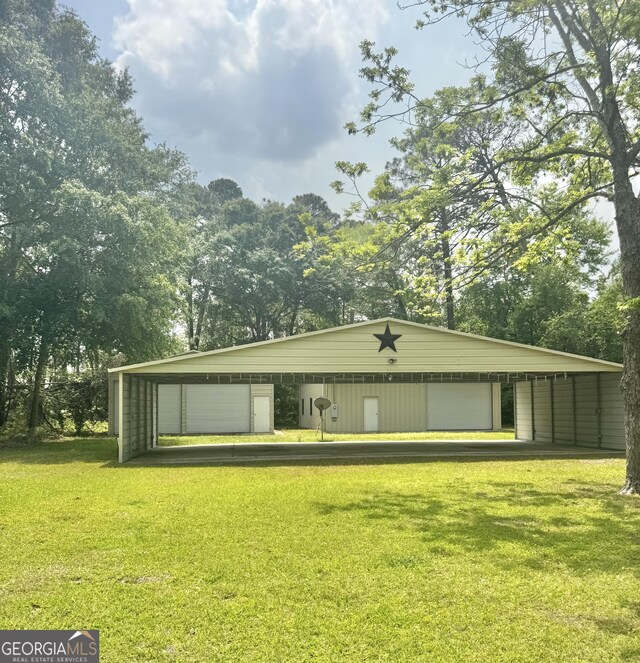 123 Blount St, Reidsville, GA 30453 - view of pole building with a lawn