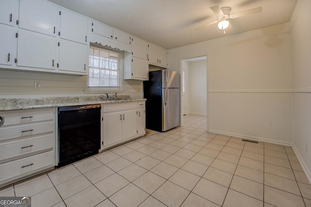 kitchen with white cabinetry, black dishwasher, stainless steel fridge, and light stone counters