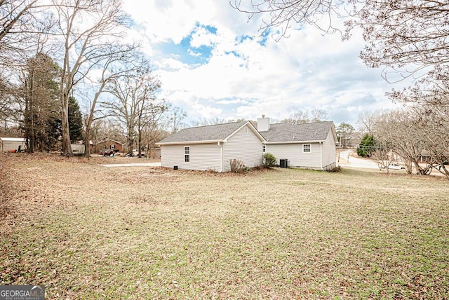 view of side of home featuring a lawn