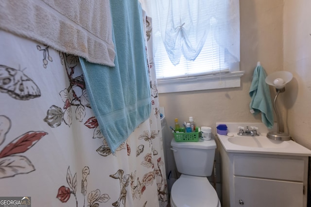 bathroom with vanity and toilet