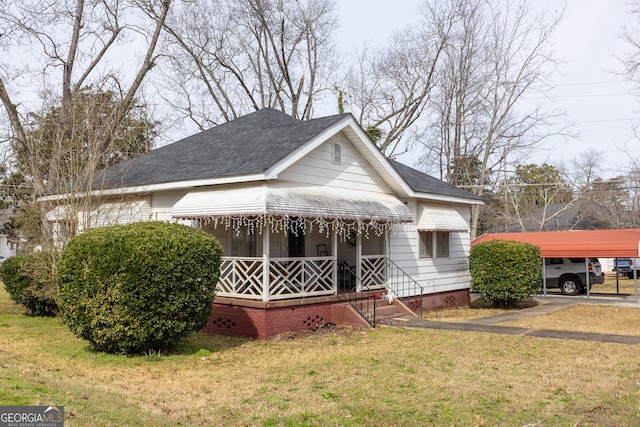 bungalow-style house with a carport and a front yard