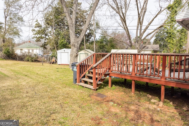 view of yard with a wooden deck and a storage shed