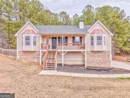 rear view of house with covered porch