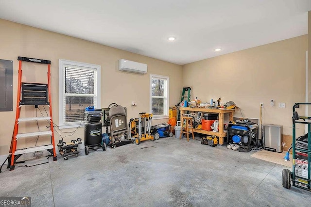 garage with recessed lighting, electric panel, and a wall unit AC