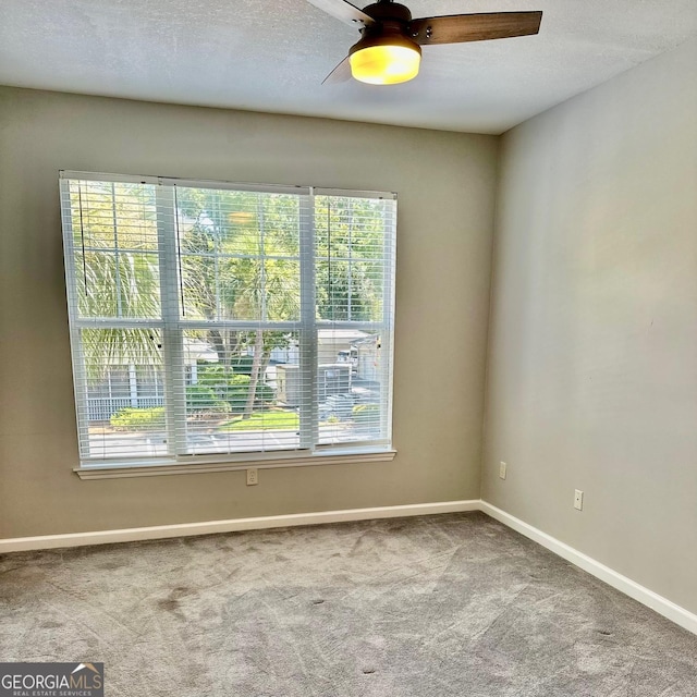 1704 Frederica Rd Unit 325, Saint Simons, GA 31522 - spare room featuring healthy amount of natural light, carpet floors, and a ceiling fan