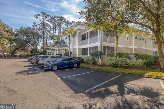 1704 Frederica Rd Unit 325, Saint Simons, GA 31522 - view of building exterior featuring uncovered parking