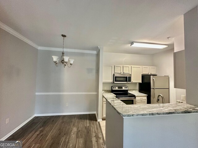 1704 Frederica Rd Unit 325, Saint Simons, GA 31522 - kitchen with stainless steel appliances, dark wood-type flooring, a chandelier, ornamental molding, and white cabinets