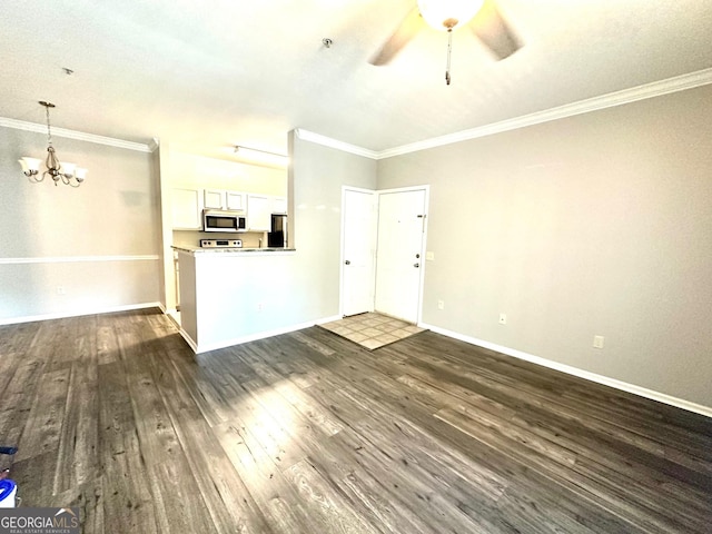 1704 Frederica Rd Unit 325, Saint Simons, GA 31522 - unfurnished living room featuring a chandelier, ornamental molding, ceiling fan, and dark wood-type flooring