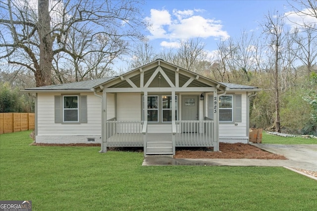 2923 Hall Dr SE, Smyrna, GA 30082 - view of front of house with covered porch, crawl space, a front yard, roof with shingles, and fence
