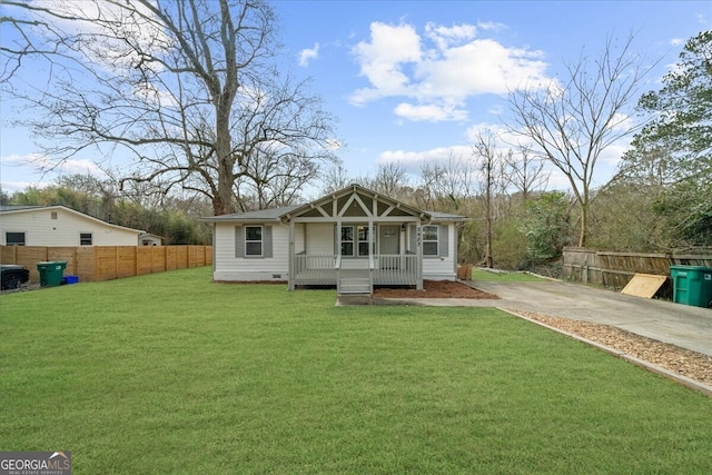 2923 Hall Dr SE, Smyrna, GA 30082 - rear view of property featuring a lawn, fence, concrete driveway, and a porch
