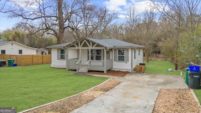 bungalow-style home with a front yard