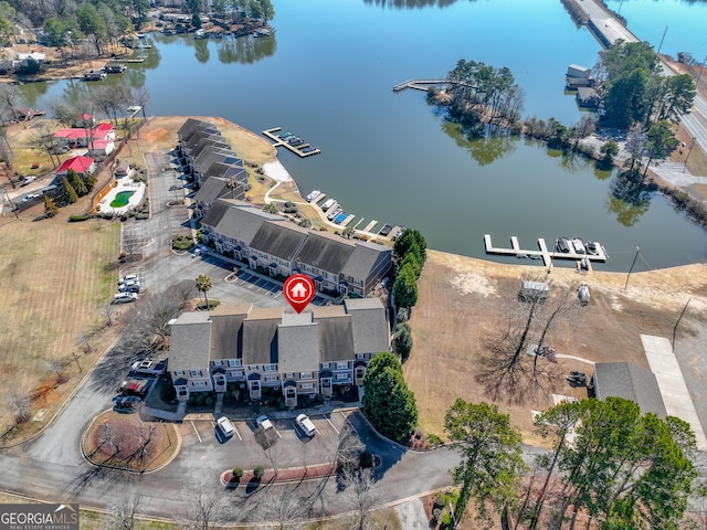 birds eye view of property featuring a water view