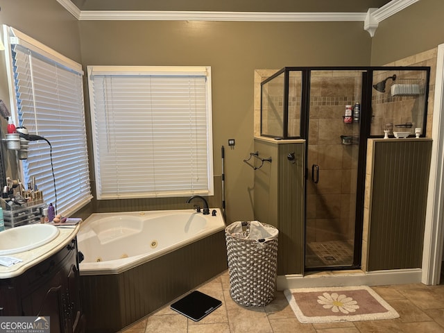 full bathroom featuring crown molding, a stall shower, vanity, tile patterned floors, and a whirlpool tub