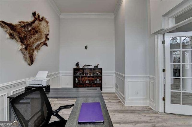 home office with ornamental molding and light wood-type flooring