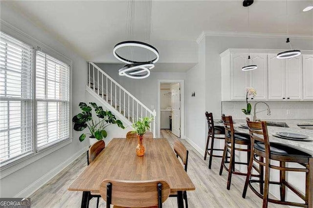 dining space featuring light wood-type flooring