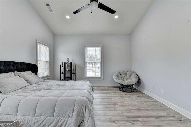 bedroom with ceiling fan and light wood-type flooring