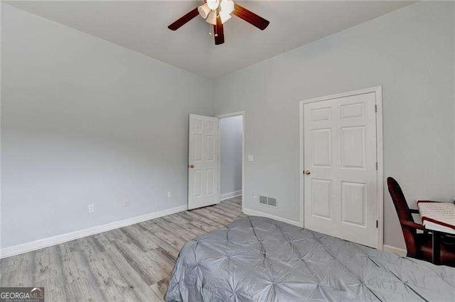 bedroom featuring ceiling fan and light hardwood / wood-style flooring