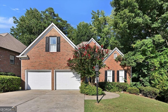 front of property with a garage and a front yard