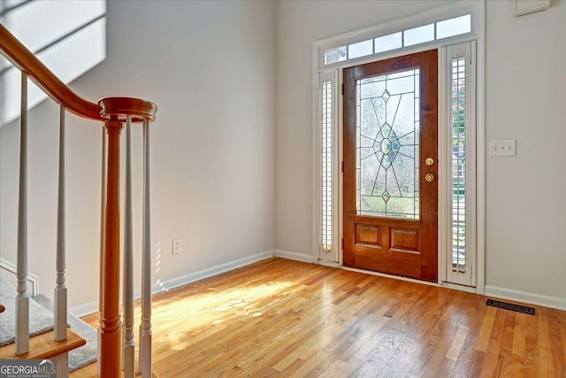 entrance foyer with plenty of natural light and light wood-type flooring