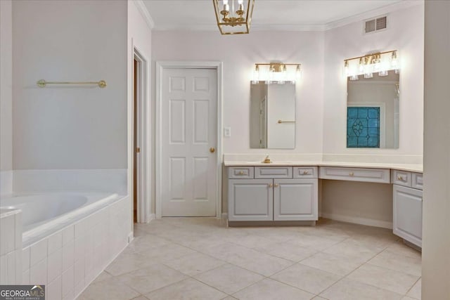 bathroom featuring tiled tub, crown molding, vanity, and tile patterned floors