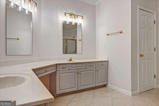 bathroom with crown molding, vanity, a shower with shower door, and tile patterned flooring