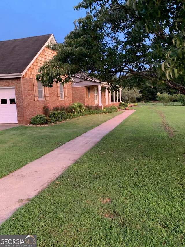 view of yard featuring a garage