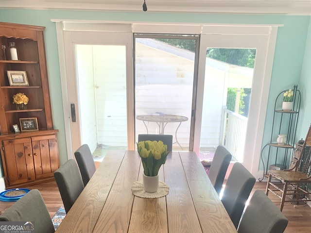 dining area with hardwood / wood-style floors