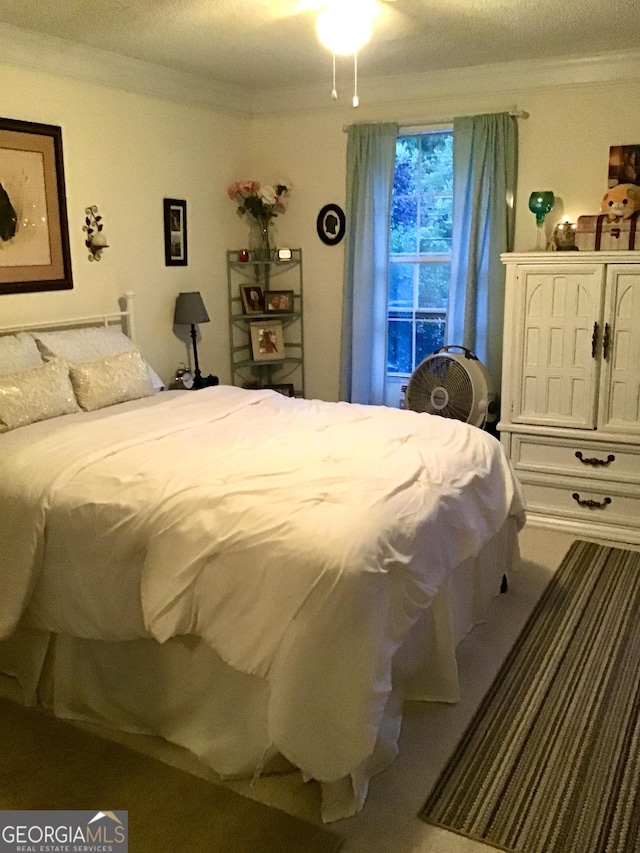 bedroom featuring crown molding