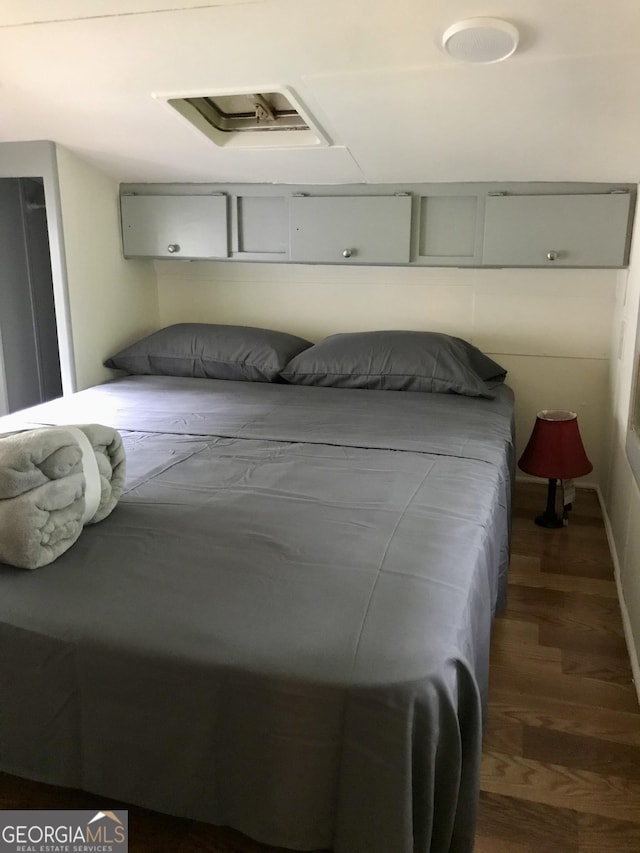 bedroom featuring dark wood-type flooring