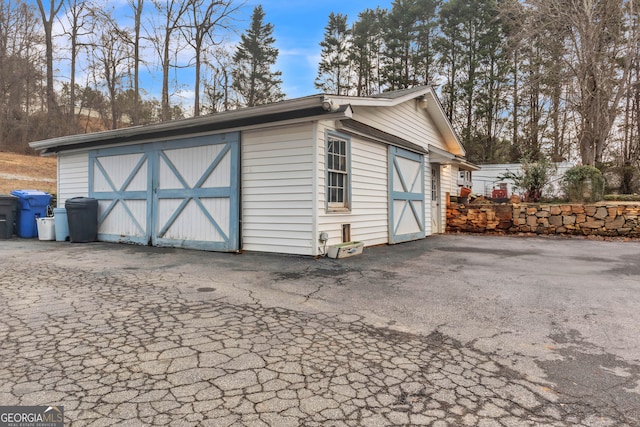 view of outbuilding with a garage