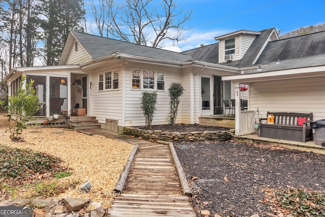 view of front of home with a sunroom