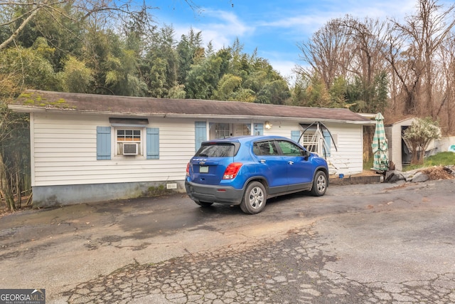 view of front of property featuring cooling unit