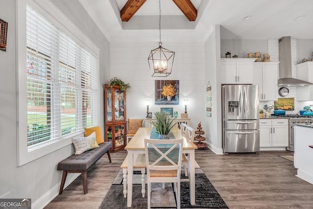 dining room featuring dark hardwood / wood-style flooring, beam ceiling, and a notable chandelier