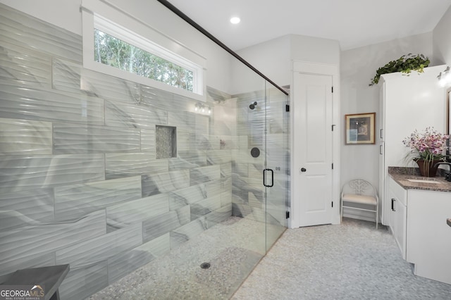 bathroom with vanity and an enclosed shower