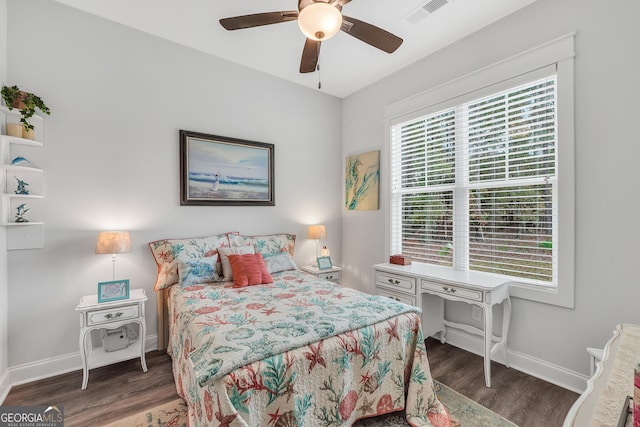 bedroom with dark wood-type flooring and ceiling fan