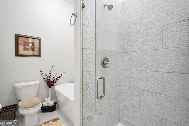 bathroom featuring tile patterned floors, toilet, and separate shower and tub