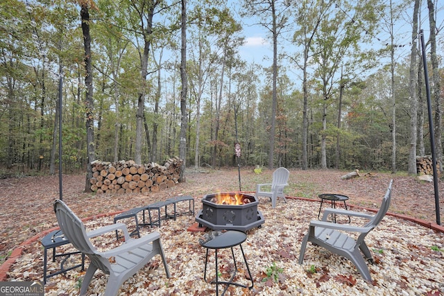 view of patio / terrace featuring an outdoor fire pit