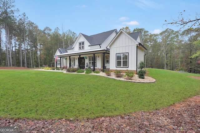 view of front facade with covered porch and a front lawn