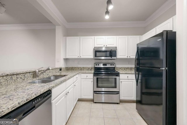 kitchen featuring light tile patterned flooring, sink, white cabinetry, ornamental molding, and stainless steel appliances