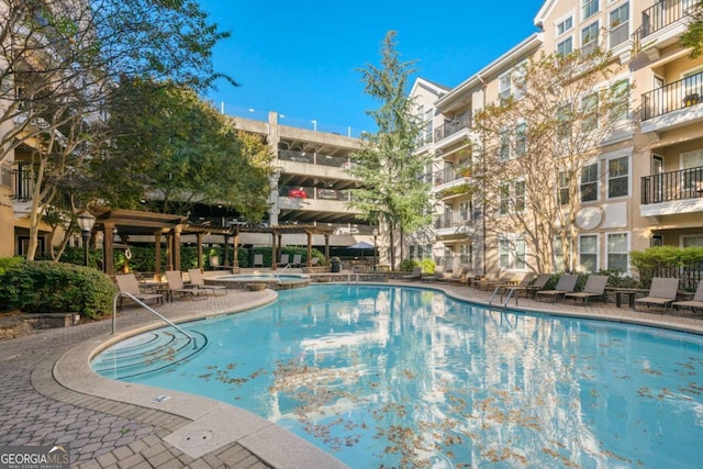 view of swimming pool with a patio