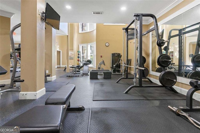 exercise room featuring ornamental molding