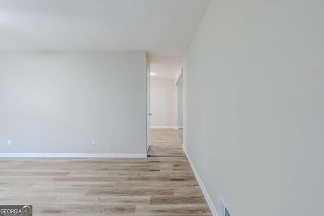 hallway featuring light wood-type flooring