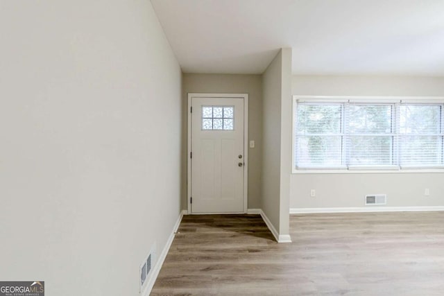 entryway with light hardwood / wood-style floors